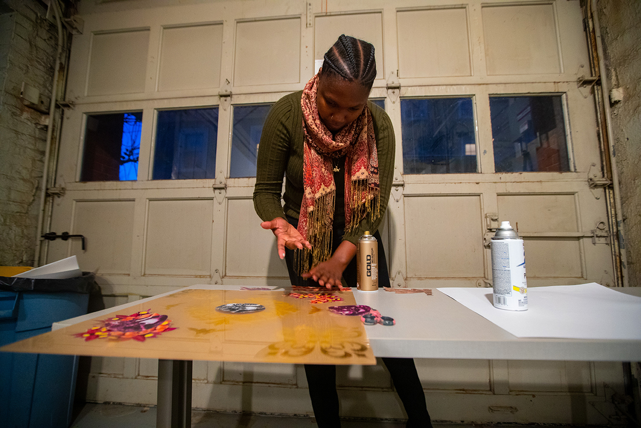 Brown and RISD students in the AFRI 1190 class work with Haitian American artist Edouard Duval-Carrie in a studio in the Nightingale Brown House.